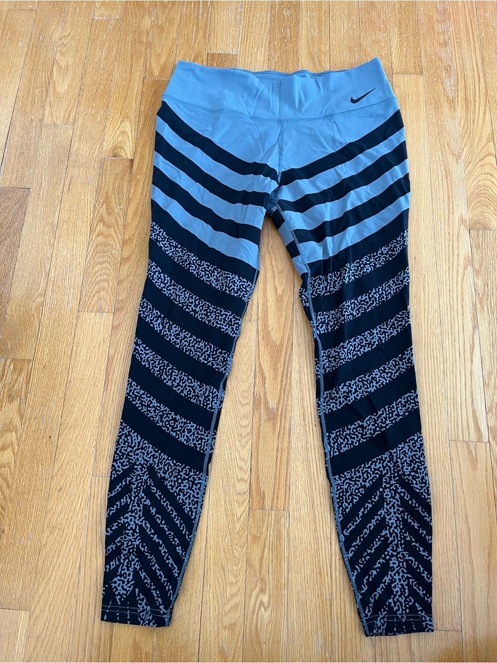 Nike Women’s Blue and Black Striped Athletic Leggings